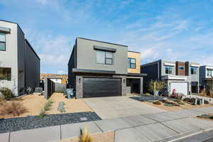 Contemporary home featuring central AC and a garage