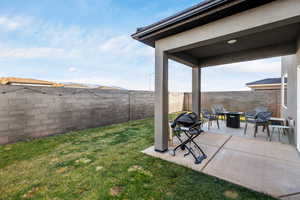 View of yard featuring a fire pit and a patio area