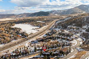 Snowy aerial view featuring a mountain view