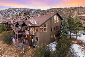 View of front of house featuring central air condition unit and a mountain view