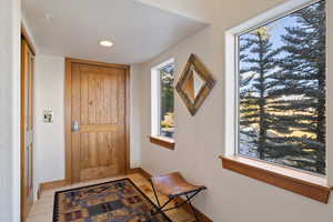 Doorway with light wood-type flooring