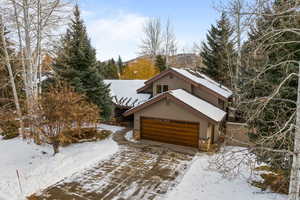 View of front of home featuring a mountain view and a garage