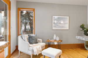 Sitting room featuring wood-type flooring