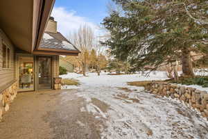 View of yard layered in snow