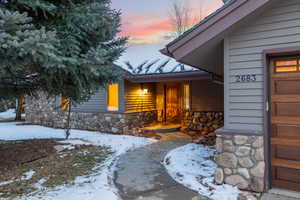 View of snow covered property entrance