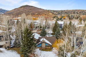 Snowy aerial view featuring a mountain view