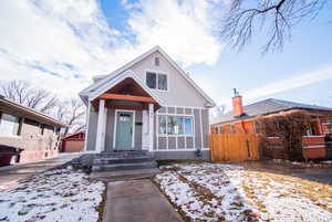 Bungalow-style home with an outbuilding and a garage