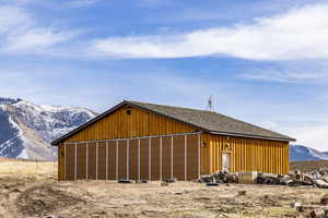 View of outbuilding with a mountain view