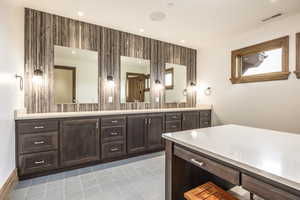 Bathroom featuring tile patterned floors and vanity