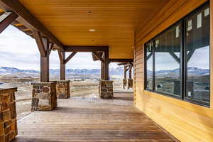 Wooden terrace featuring a mountain view