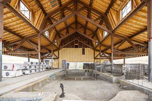 Misc room featuring vaulted ceiling with beams and plenty of natural light