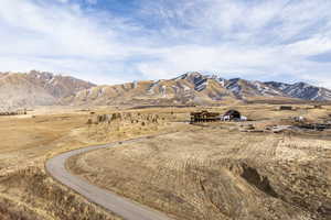 Property view of mountains with a rural view