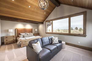 Bedroom with lofted ceiling with beams, light colored carpet, wood ceiling, and an inviting chandelier