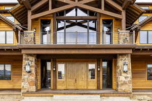 Property entrance featuring a balcony