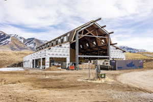 Rear view of house featuring a mountain view