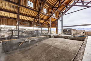 View of horse barn with a mountain view