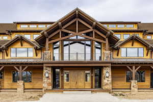 View of front of property with a balcony