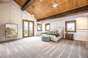 Carpeted bedroom featuring access to exterior, french doors, an inviting chandelier, and wooden ceiling