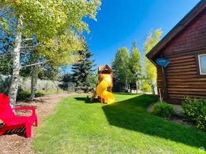 View of yard featuring a playground