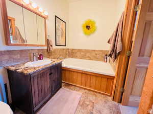 Bathroom with a bathtub and vanity