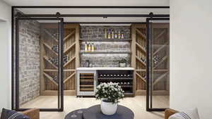 Wine cellar featuring wood-type flooring