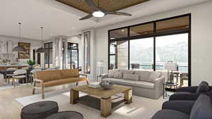 Living room with a mountain view, ceiling fan, and light wood-type flooring