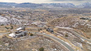 Snowy aerial view featuring a mountain view