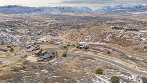 Snowy aerial view featuring a mountain view