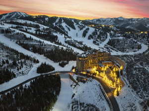 Snowy aerial view featuring a mountain view