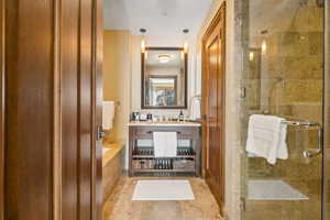 Bathroom featuring tile patterned floors and walk in shower