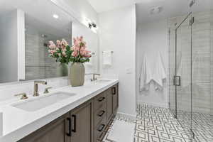 Bathroom featuring vanity and walk in shower