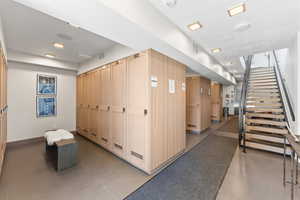 Hallway with concrete floors and a textured ceiling