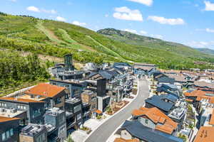 Birds eye view of property with a mountain view