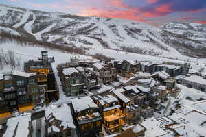 Snowy aerial view featuring a mountain view