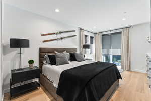 Bedroom featuring access to exterior and light wood-type flooring