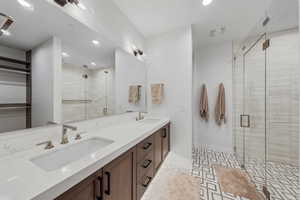 Bathroom with walk in shower and vanity