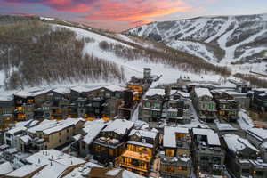 Snowy aerial view featuring a mountain view