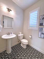 Bathroom with sink and toilet