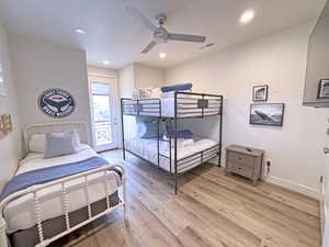 Bedroom with access to exterior, light hardwood / wood-style flooring, and ceiling fan