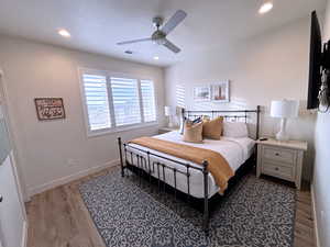 Bedroom featuring ceiling fan and light wood-type flooring