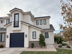 View of front facade featuring a garage