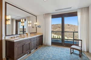 Bathroom with vanity and a wealth of natural light