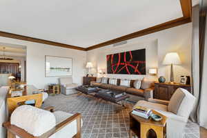 Living room featuring ornamental molding