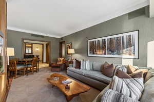 Living room featuring crown molding