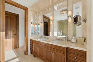 Bathroom featuring tile patterned flooring and vanity