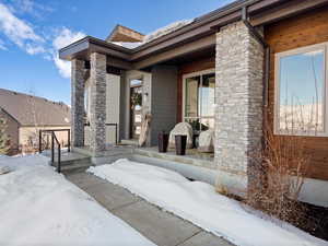 View of snow covered property entrance