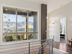 Staircase with a mountain view and plenty of natural light