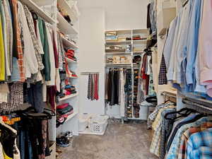 Walk in closet featuring carpet