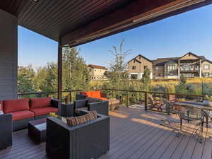 Wooden terrace featuring an outdoor hangout area