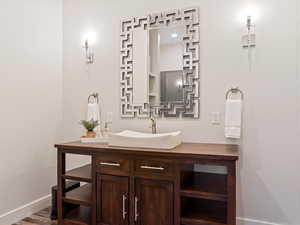 Bathroom featuring hardwood / wood-style flooring and vanity